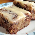 Delicious banana bread brownies with chocolate drizzle and banana slices