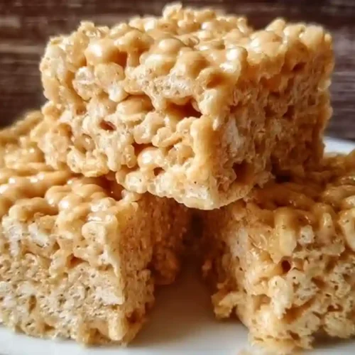 Peanut Butter Rice Krispie Treats stacked on a plate