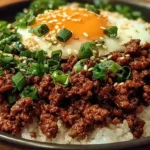 Delicious Korean Ground Beef Bowl garnished with vegetables and rice