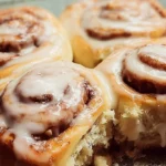 Freshly baked homemade cinnamon rolls with cream cheese frosting