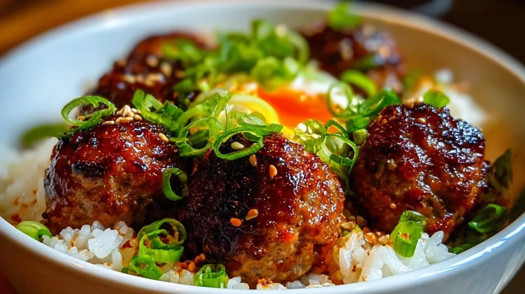 Serving of Korean BBQ meatball rice bowls topped with fresh vegetables